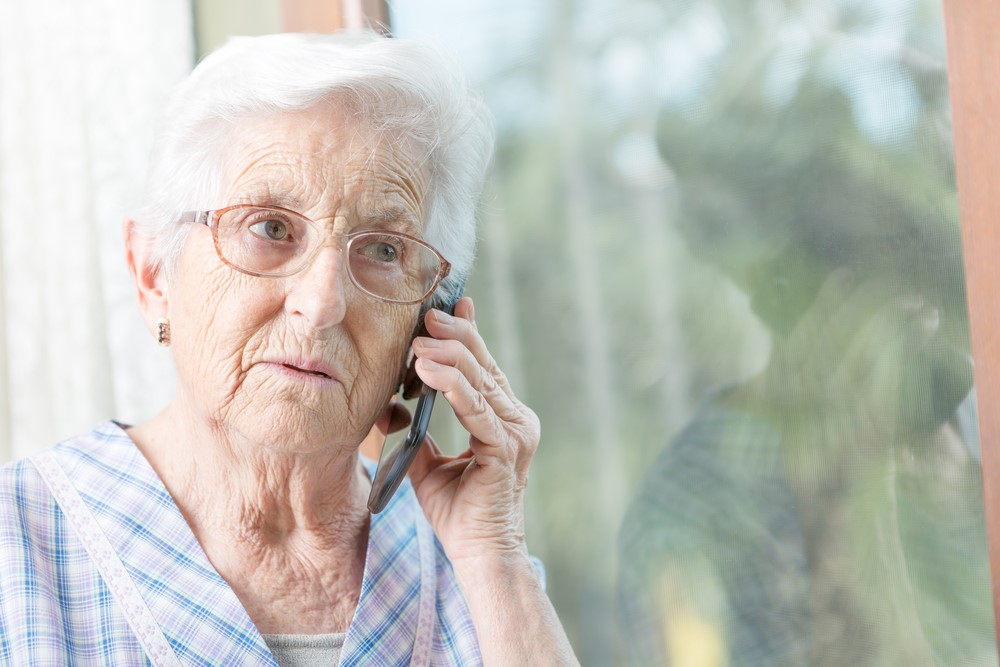 Elderly Woman staying connected while on phone